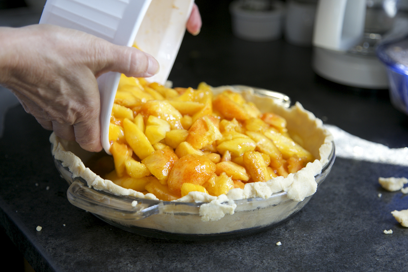 Finch's Landing peach pie being made